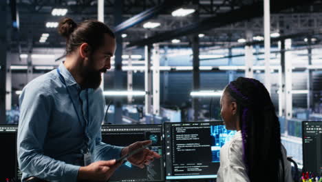 manager supervising woman in data center coding with generative ai