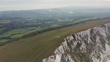 Aerial-Drone-orbit-over-sea-cliffs-at-Tennyson-Monument-Isle-of-Wight