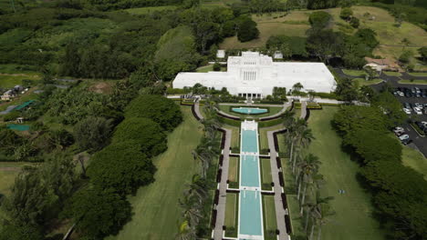 Slow-aerial-zoom-out-over-Laie-Hawaii-LDS-Temple-in-Oahu,-Hawaii