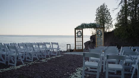 cinematic shot of a wedding ceremony site located on the shoreline