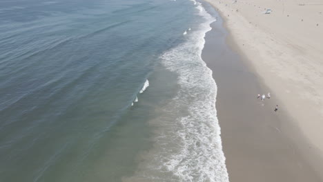 pacific ocean seen above as a drone coasts along towards malibu