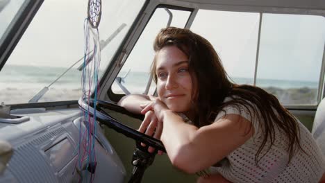 young woman leaning on steering wheel 4k