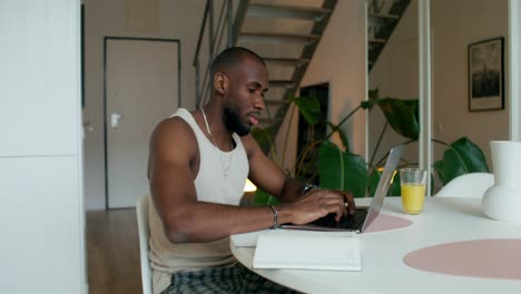 man working from home in modern kitchen