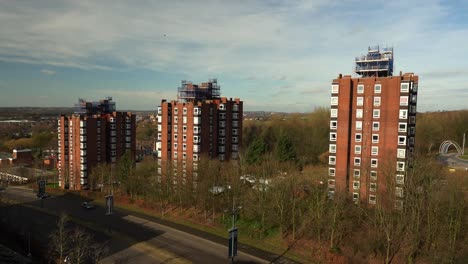 High-rise-tower-blocks,-flats-built-in-the-city-of-Stoke-on-Trent-to-accommodate-the-increasing-population,-housing-crisis-and-over-crowding,-immigration-housing