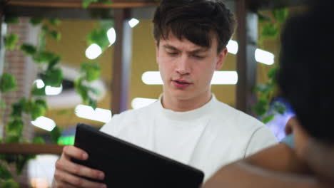 Beautiful background display of vibrant flowers and dazzling lights framing glowing television screen with soft blur and dynamic colour shifts creating dreamy glowing ambiance with atmospheric depth