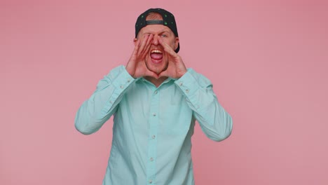 expressive man holding hands near mouth loudly screaming shouting yelling announces discounts sale