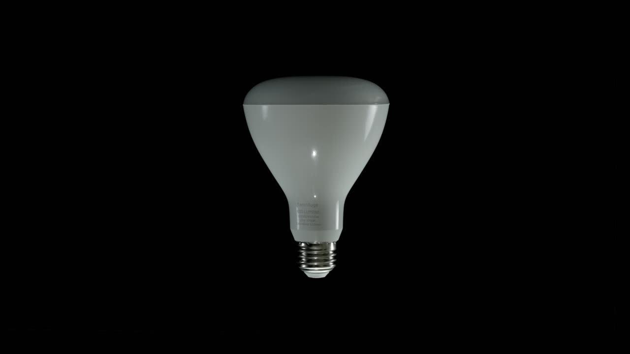 Modern LED Lightbulb Standing Upright Isolated on Black Background Shot