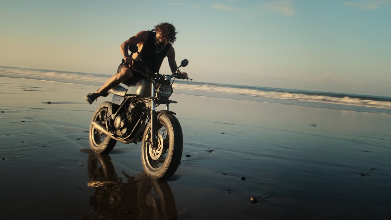 Motorcycle Adventure on the Beach at Sunset