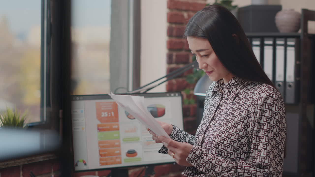 Close up of woman analyzing documents in office