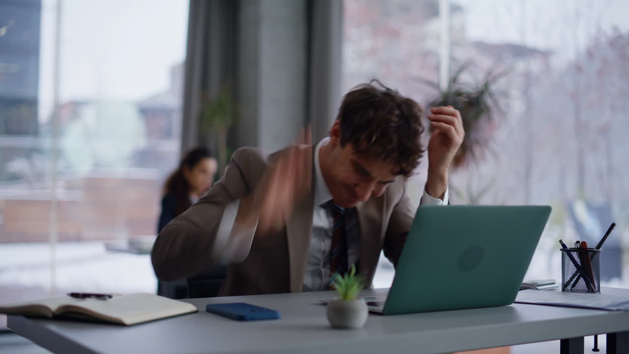Businessman receiving bad news at panorama coworking closeup. Boss hitting table