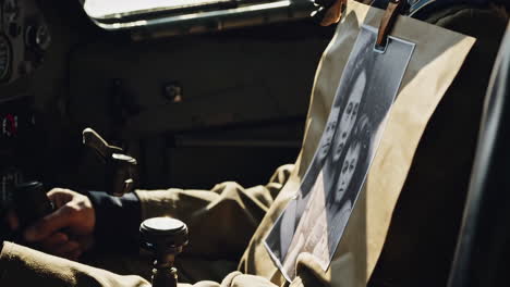 pilot in cockpit with family photo