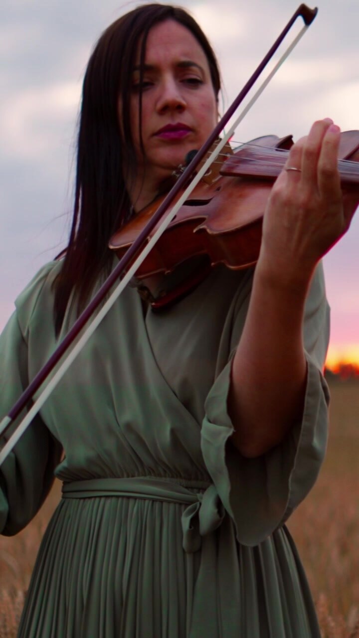 Woman Playing Violin in a Wheat Field at Sunset