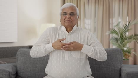 Happy-Indian-old-man-doing-breathe-in-breathe-out-exercise