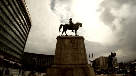 monument of ataturk on horse on background of cloudy sky pigeons flies ankara