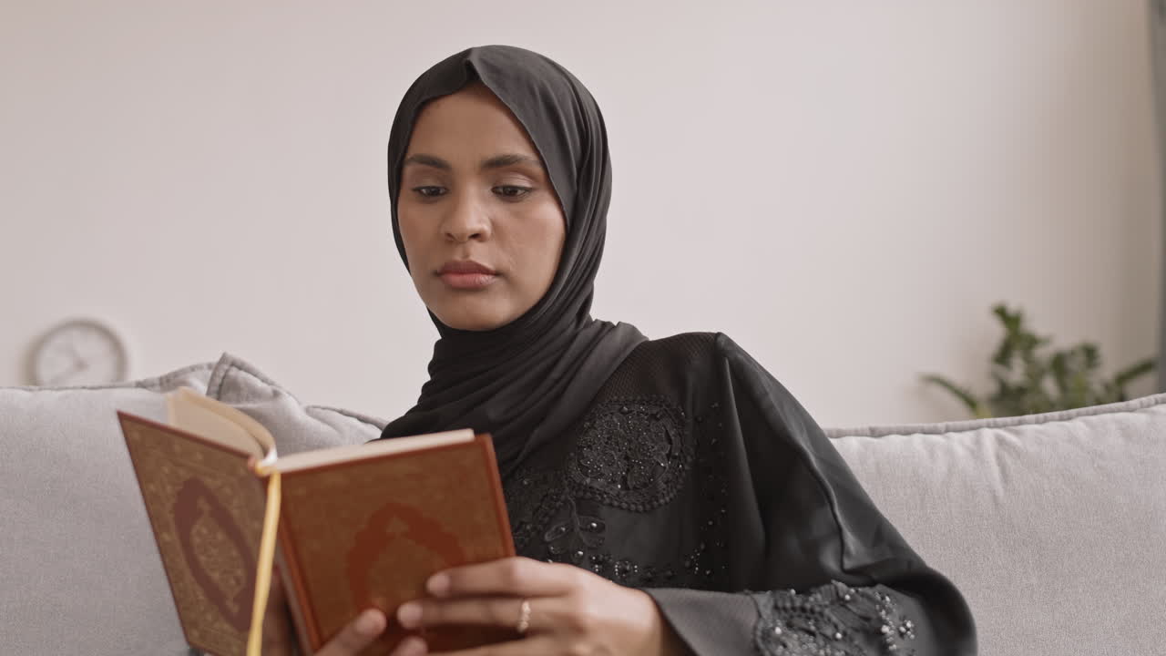 Young Muslim Woman Reading Koran