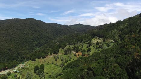beautiful green lush hillsides of costa rica's mountain range in the sun