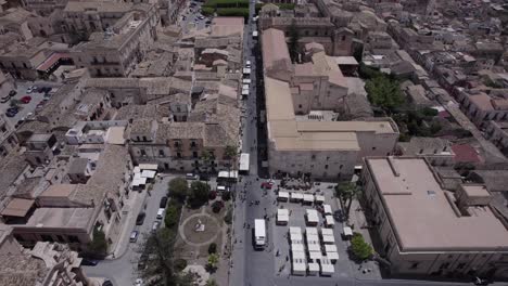 aerial establishing toward cathedral and palazzo ducezio, noto sicily