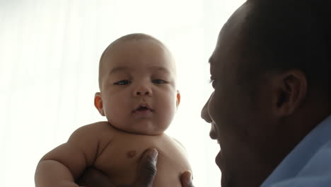 father holding his baby