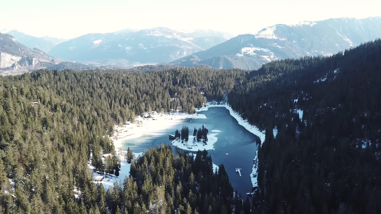 Aerial View of Frozen Lake in Winter Mountains