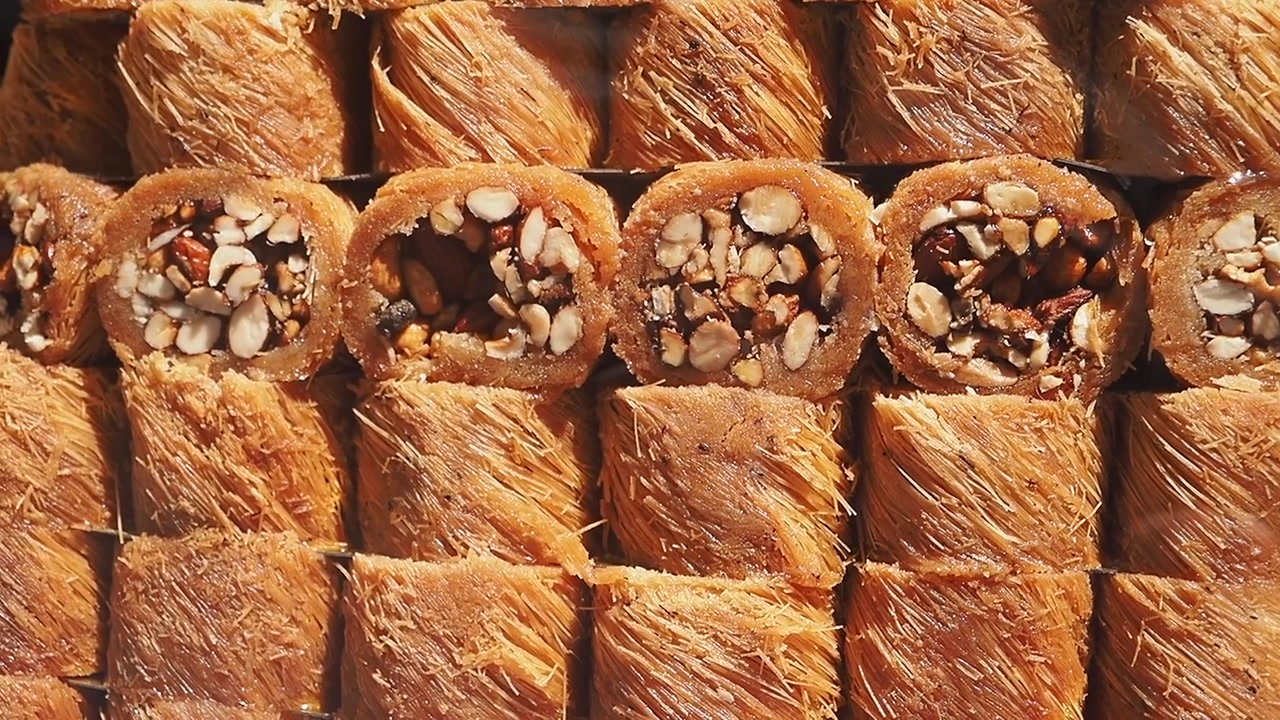 Rows of Traditional Middle Eastern Baklava Pastries with Nuts