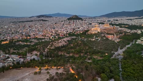 parthenon and acropolis hill at dusk– aerial view over athens