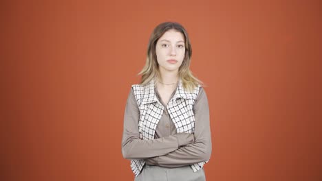 Young-woman-looking-at-camera-with-dull-expression.