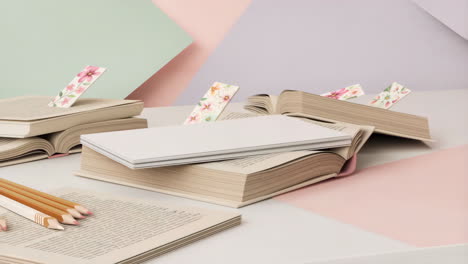 aesthetic study scene with books, bookmarks, and pencils