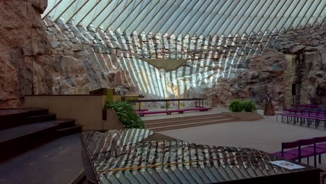 parallax slider shot of piano, altar, and stunning ceiling reflection at rock church