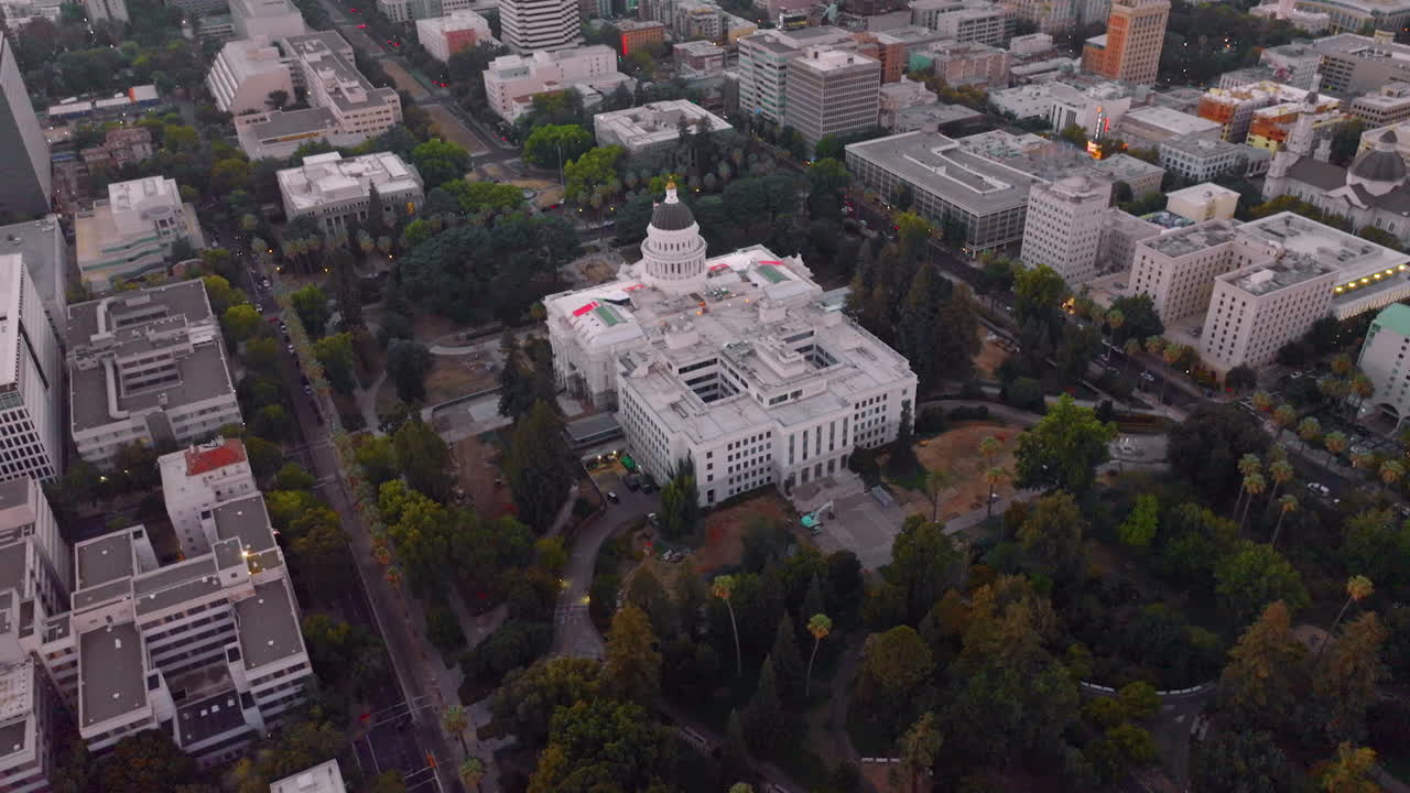 Stunning building of California State Capitol in Sacramento, USA. Aerial view of the establishment surrounded by beautiful green park.