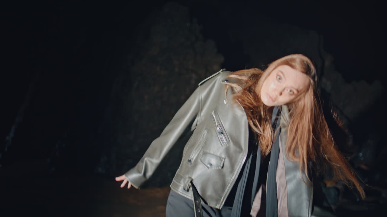 Emotional woman wild dance at night beach party portrait. Performer dancing