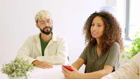 people bored during a large meeting in a coworking