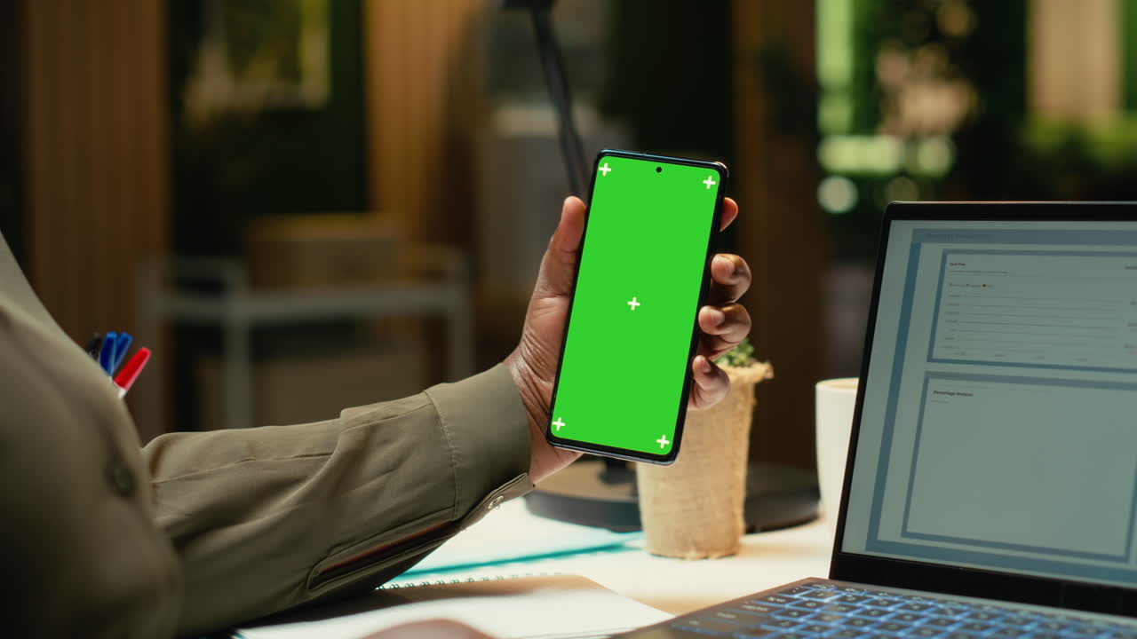 Isolated mockup vertical screen on phone where black office employee finishing tasks