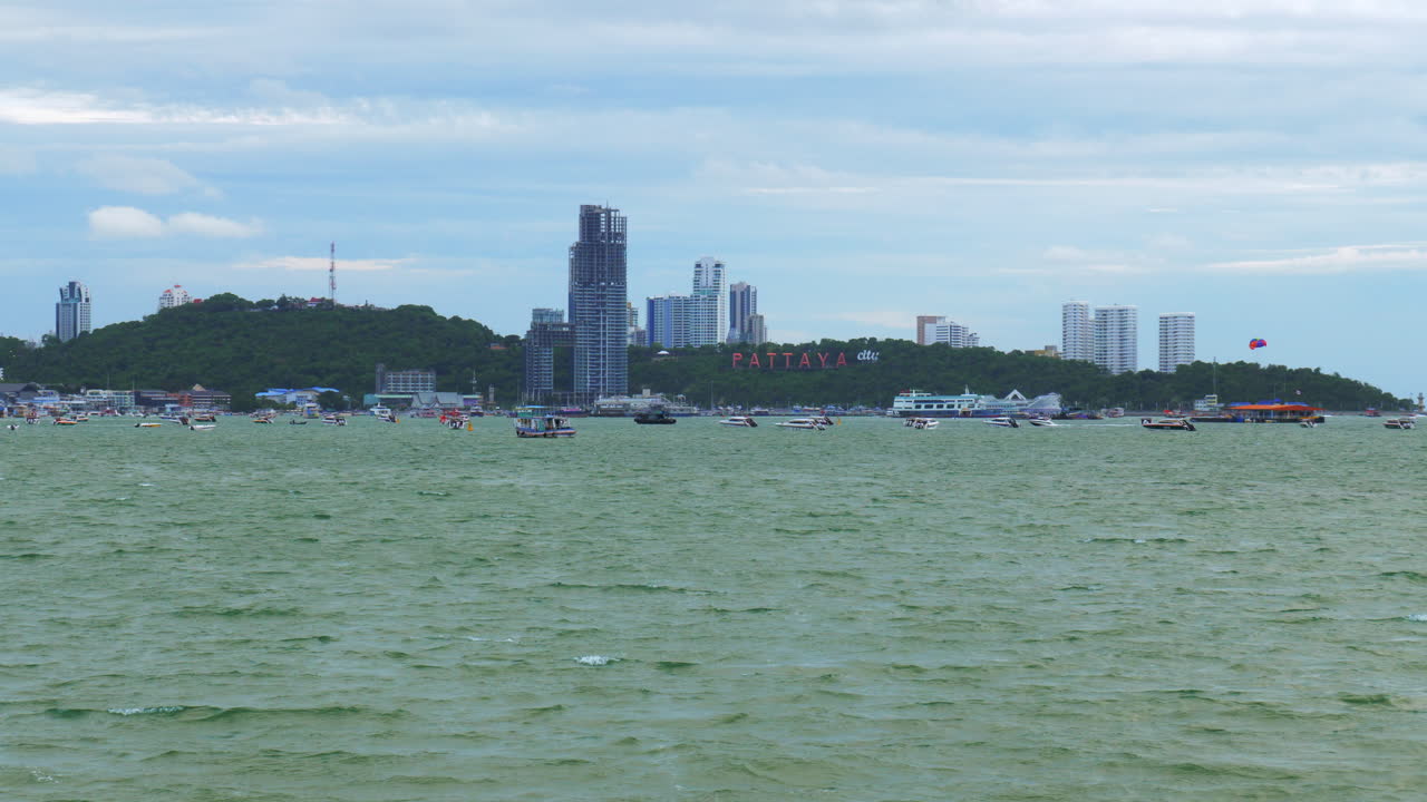 A view of the marina and business center of Pattaya Beach from across the gulf, where hotels, condominiums, boats, jetski, and shopping centers are located, in Chonburi province, Thailand