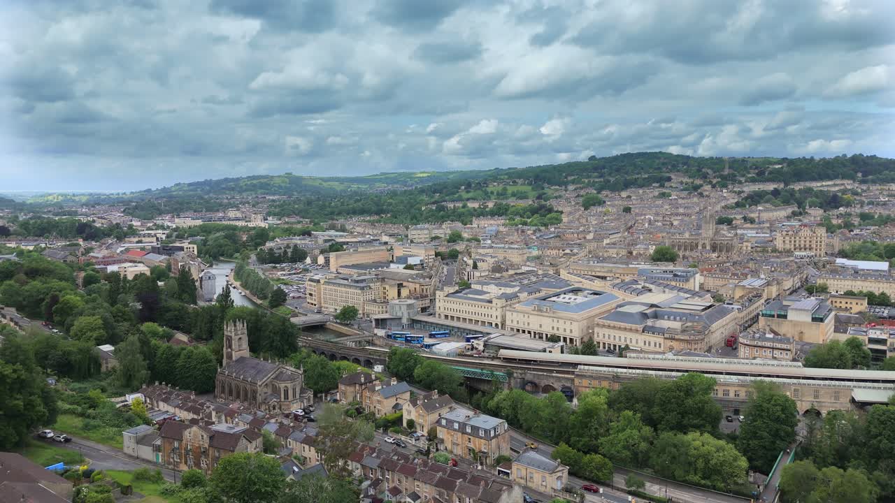 Wide angle drone shot from Lyncombe Hill vista of the City of Bath, descending with pretty parallax effect.