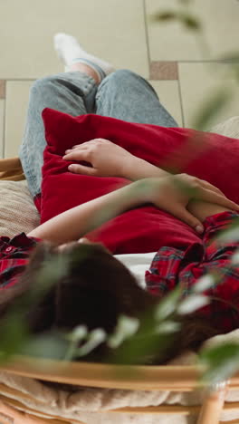 lady seeks refuge in embrace with cushion. woman experiences profound sadness feeling isolated without any support or companionship. woman loneliness