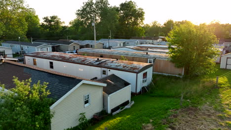 aerial orbit and pull back to reveal mobile homes packed in small aerial