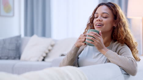 happy adult woman, morning coffee on sofa