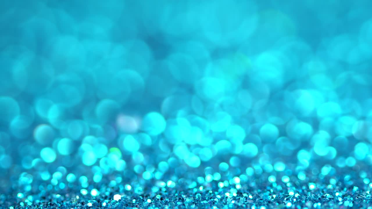 Blue glitter festive defocused lights background. Brilliant background for Christmas and new year holiday. A beautiful magic bokeh