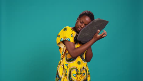 Tired-overworked-girl-sleeping-on-a-pillow-standing-in-studio