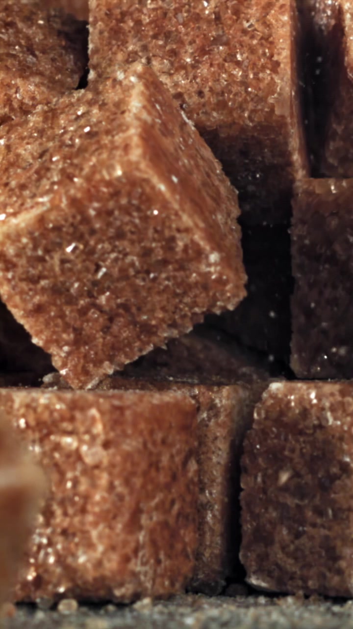 Brown Sugar Cubes Falling in Slow Motion Macro Shot