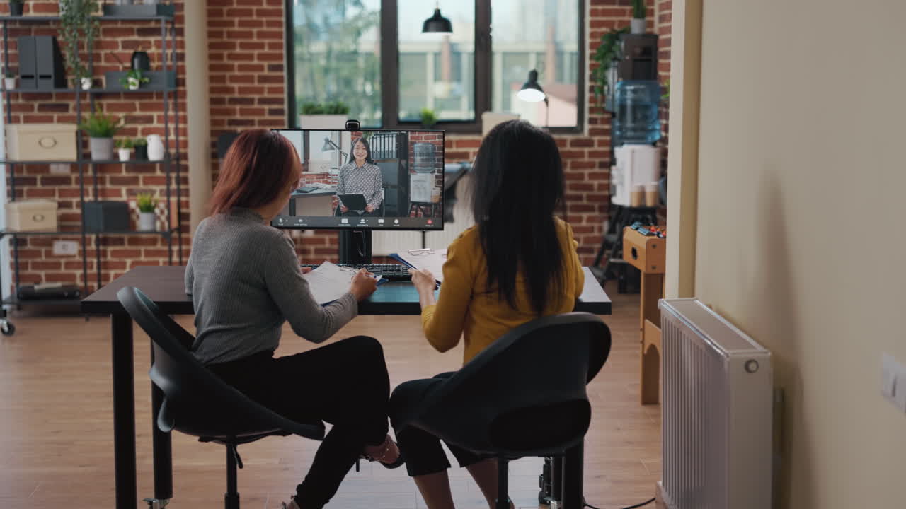 Team of asian women meeting with candidate on video conference call