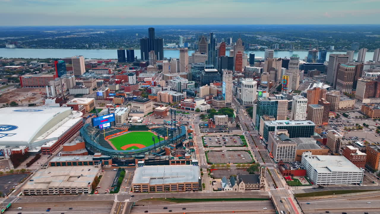 Scenery of Detroit downtown with sport stadium and arena. The Detroit river at backdrop. Aerial view