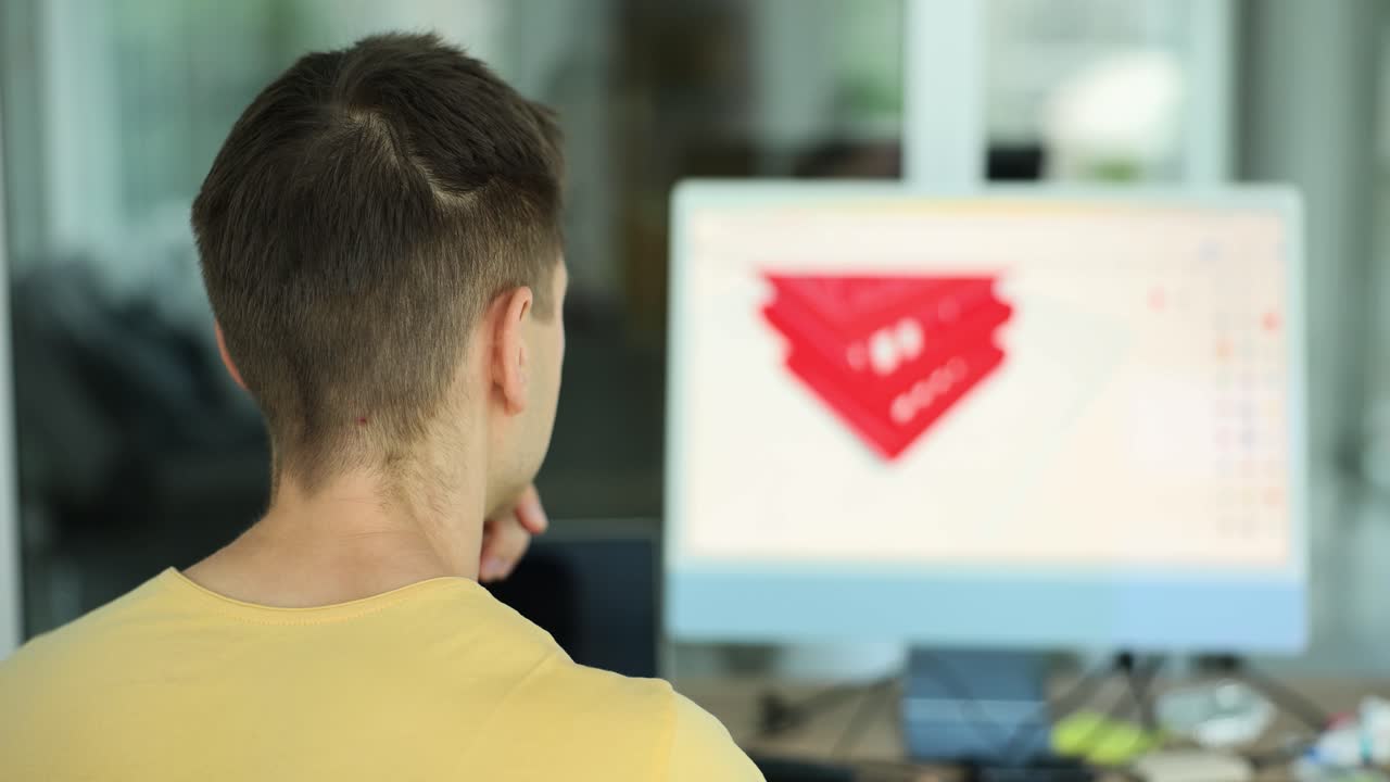 Man working on 3D design using computer software