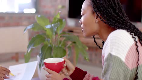 African-american-casual-businesswoman-in-discussion-in-casual-office-meeting