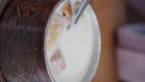 traditional turkish yogurt soup in a copper bowl