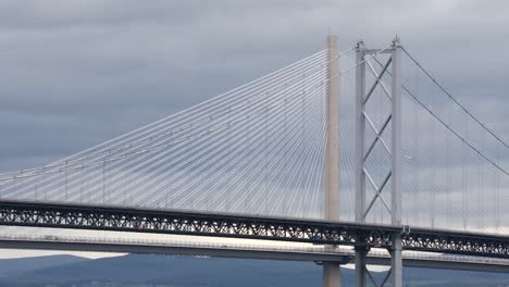 Queensferry-and-Forth-road-bridge-with-rush-hour-traffic,-close-up-of-towers