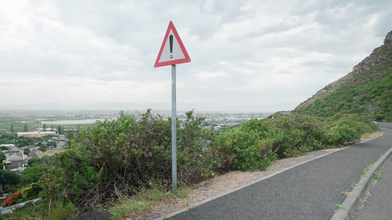 Wide angle of caution sign on Boys drive