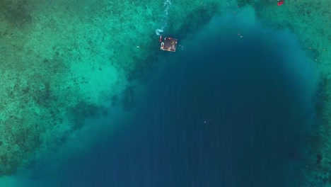 overhead boom down aerial view of the pristine waters of jan thiel beach, curacao, dutch caribbean island