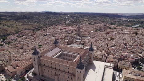 epic aerial flying around alcazar de toledo fortification in toledo, spain