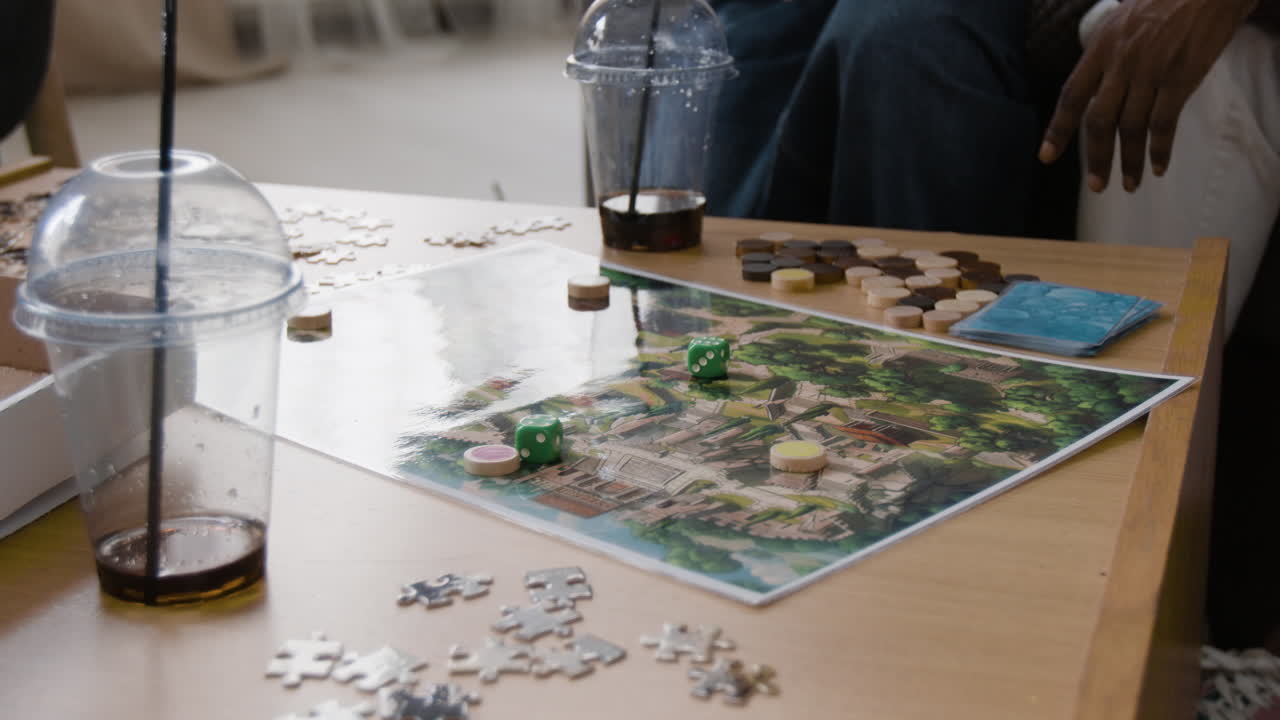 Friends playing board games and solving puzzles during a social gathering